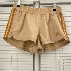 adidas Women's Beige Athletic Shorts with Gold Stripes